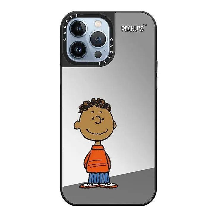 Mirror phone case showcasing Peanuts character Franklin in his signature orange shirt and blue pants.   Includes  PEANUTS branding on black background.
