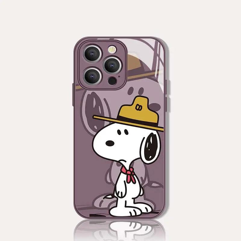  Clear purple anime phone case featuring Snoopy wearing a yellow cap and red scarf. The classic Peanuts character stands in side profile against a soft purple background with subtle Snoopy silhouettes.