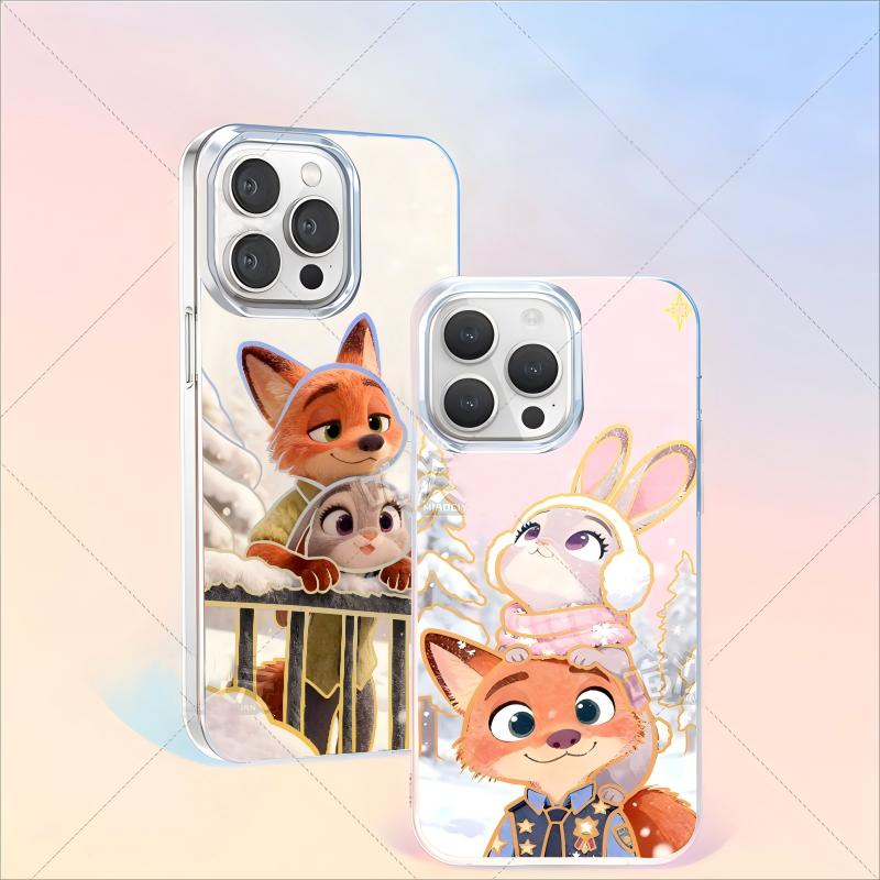 Two Zootopia Phone case designs: one with Nick and Judy at a snowy railing, another with Judy perched on Nick's head. Both show the animated characters in detailed winterwear.